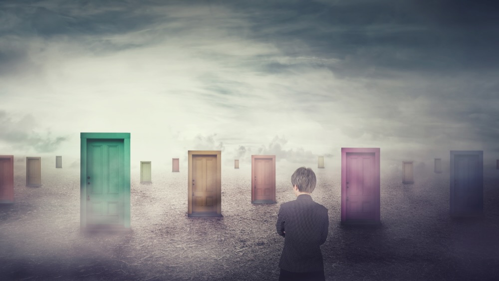 Businesswoman in front of many different doors choosing one. Difficult decision, important choice concept, failure or success. Ways to unknown future, business career development opportunity.
